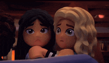 two lego girls are sitting next to each other and looking at something