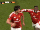 a soccer player in a red jersey with the word vodafone on the front