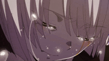 a close up of a person 's face with tears coming out of their eyes