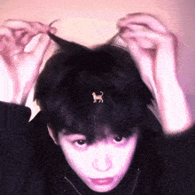a person with a cat earring on their head