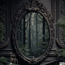 a bathroom with a mirror that looks like a forest