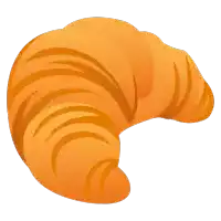 a close up of a croissant on a white surface