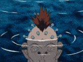 a man with a mohawk is swimming in the ocean