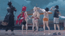 a group of anime characters are standing next to each other on the beach .