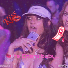a pixel art of a woman holding a cell phone with a kiss written on it