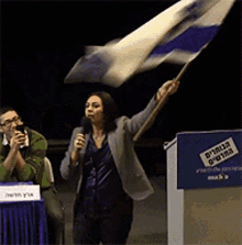 Miri Regev Waving Flag GIF - Miri Regev Waving Flag Israel Flag GIFs