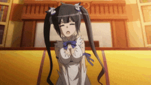 a girl with pigtails has her eyes closed and a bow on her chest