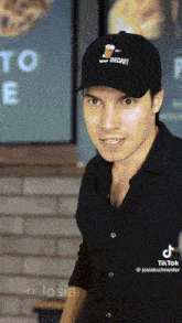 a man wearing a hat that says decaf