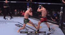 two men are fighting in a ufc ring and the scoreboard says garry 1 to 1