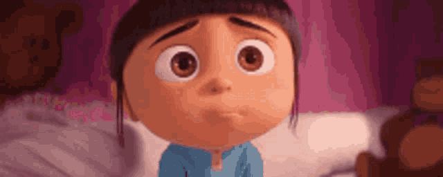 a cartoon girl is sitting on a bed with a teddy bear in the background and making a sad face .