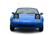 a blue sports car with its headlights on