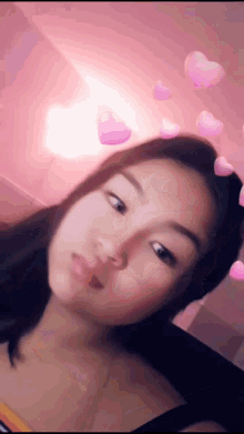 a girl with pink hearts around her head