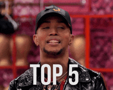 a man wearing a black hat and a leather jacket says " top 5 "