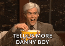 a man in a suit is holding a bucket of popcorn with the words tell us more danny boy above him