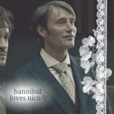 a picture of a man in a suit and tie with the words hannibal loves nico below him