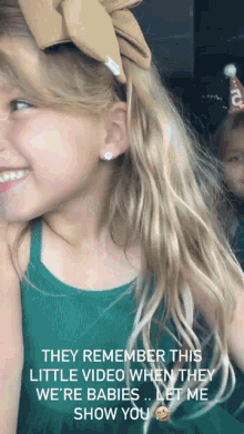 a little girl with a bow in her hair says they remember this little video when they we 're babies