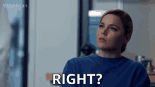 a woman in a blue sweater is asking the question right