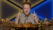 a man sticking his tongue out next to a sign that says " never stop "