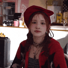 a girl wearing a red beret and a red sweater
