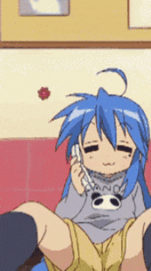 a blue haired anime girl is talking on a phone