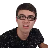 a man wearing glasses and a black shirt with white spots is making a funny face