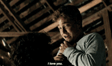 a man is hugging another man who is crying and says " i love you "
