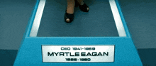 the name myrtle egan is on a blue sign
