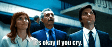 a man in a suit says " it 's okay if you cry " while standing next to a woman