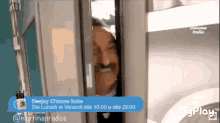 a man with a mustache is peeking out of a door that says deejay chiama italia at the bottom