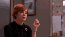 And You’re Standing There Like, “i Know What You Did.” GIF - Christina Hendricks Laugh Lol GIFs