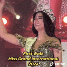 a woman wearing a crown and a sash that says miss grand international 2024