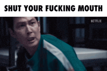 a man in a green jacket with the words shut your fucking mouth on the bottom
