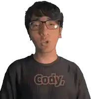 a man wearing glasses and a black shirt that says cody on it