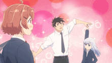 a man in a white shirt and tie is pointing at a girl in a suit