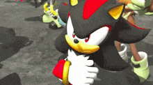 shadow the hedgehog from sonic the hedgehog is holding a red ring