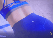 a blurred image of a woman 's back with the number 18 on the bottom right