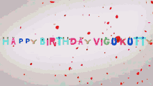 a happy birthday message with red petals falling