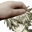 a close up of a person 's hand on a man 's face .