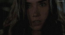a close up of a woman 's face with the words illusive soul visible