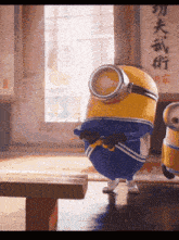 two minions are dancing in a room with chinese writing on the wall behind them