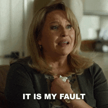 a woman is crying and the words it is my fault are on the screen