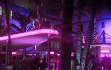 a pole dancer in front of a sinful sign