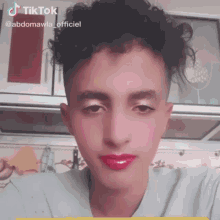 a close up of a person 's face with tiktok written on the bottom right