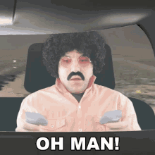 a man with an afro and mustache is sitting in a car with the words oh man behind him