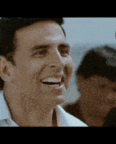 a close up of a man 's face with a laughing expression .