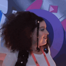a woman with a lanyard around her neck that says youtube
