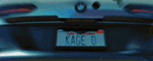 a bmw with a california license plate that says kage 0