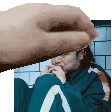 a pixel art of a hand holding a person 's face .
