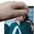 a pixel art of a hand holding a person 's face .