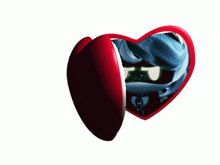 a heart shaped mirror with a picture of a cartoon character inside of it